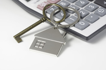 House key chain, bronze key  and calculator