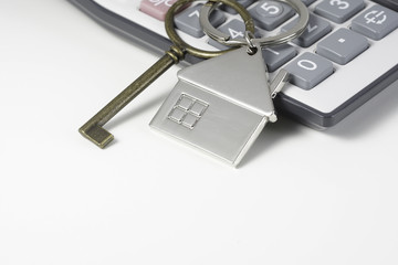 House key chain, bronze key  and calculator