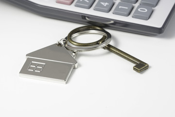 House key chain, bronze key  and calculator