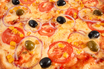 Pizza Vegetarian with tomatoes, corn, onion, green and black olives isolated on white, closeup