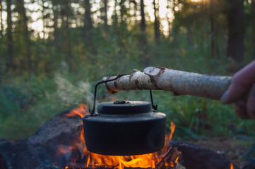 Life around the campfire in the forest making coffee