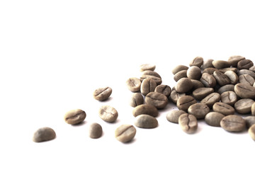 Close up raw coffee beans on a white background.