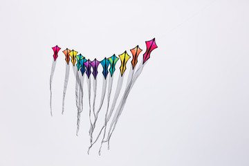 A pillar of colorful kites