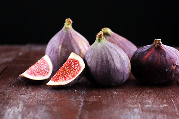 Fresh figs. Food Photo. whole and sliced figs on rustic background.