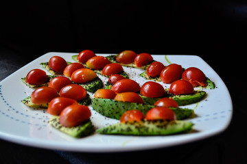 breakfast with cherry tomatoes, avocado and seeds