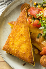 Fried Polenta with Sausage Stew