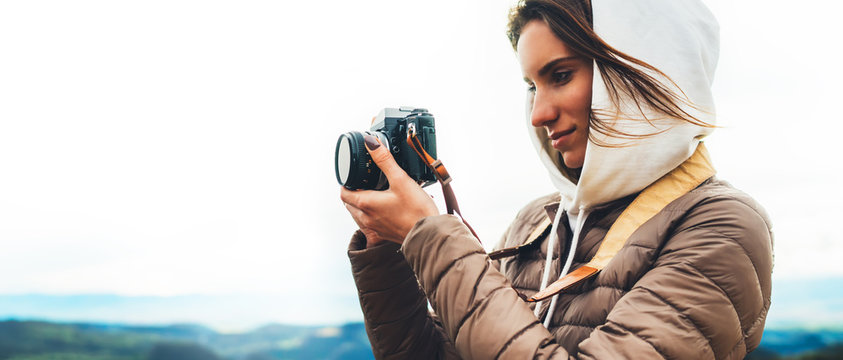 photographer traveler on top on mountain, tourist looking enjoy nature panoramic landscape in trip, girl holding in hands digital photo camera, hiker taking click photography, holiday hobby concept