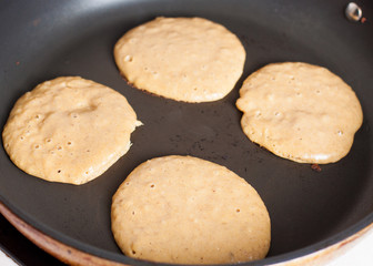 Cooking of paleo apple-cinnamon pancakes