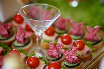 Canape and sandwiches with meat and sausage.