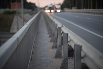 Anodized safety steel barrier on freeway bridge - 219460458
