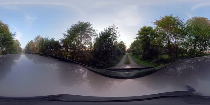 360 VR Video. Driving car on a country road sunset.