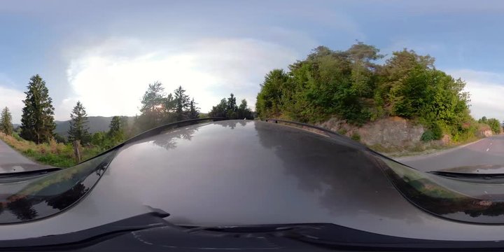 360 VR Video. Driving car on asphalt country road at sunset