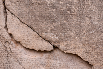 ancient Greek writing chiseled on stone