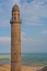 Minaret of the Great Mosque known also as Ulu Cami with mesopotamian plain in the background,...