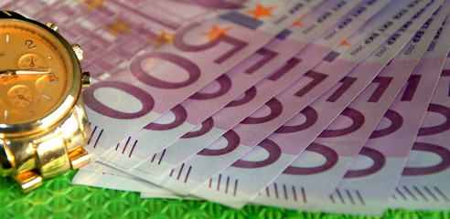 European Euro banknotes and watches, Time is money.