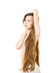 Fototapeta premium Emotional portrait of a naked young woman with very long hair.