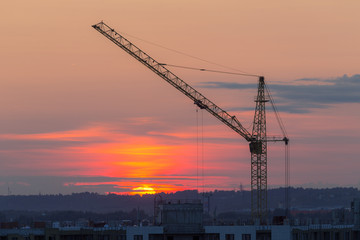 Fototapeta na wymiar construction crane on a sunset