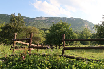 Fototapeta na wymiar Wooden fence in a rural area