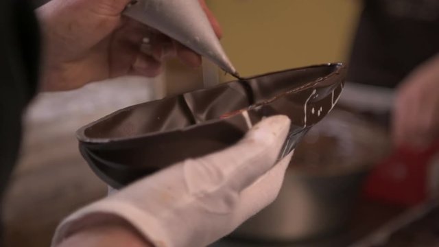 Slow motion close up, designing chocolate
