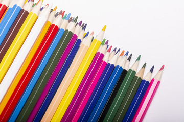 Close-up of colored pencils on white background