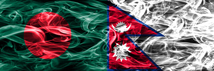 Bangladesh vs Nepal smoke flags placed side by side. Thick colored silky smoke flags of Bangladesh and Nepal