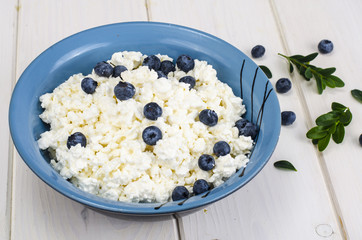 Fresh rustic cottage cheese with blueberry