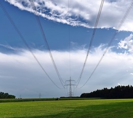 Fototapeta na wymiar Power supply line pylon in the countryside