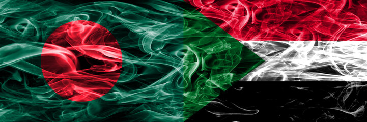 Bangladesh vs Sudan smoke flags placed side by side. Thick colored silky smoke flags of Bangladesh and Sudan