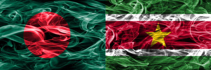 Bangladesh vs Suriname smoke flags placed side by side. Thick colored silky smoke flags of Bangladesh and Suriname