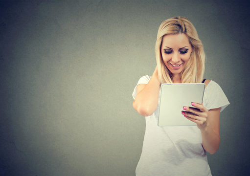 Smiling woman using modern tablet