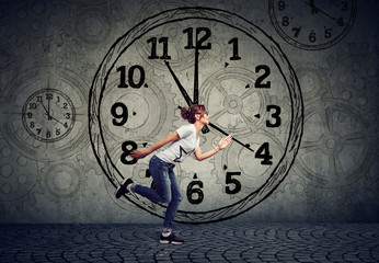 Young business woman running out of time