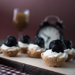 small pastries, clock and drink