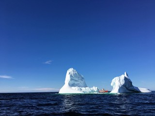 tour boat viewing massive iceberg off the coast of Twilingate, Newfoundland and Labrador, Canada