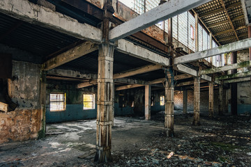 Fototapeta na wymiar Dark interior of empty abandoned factory