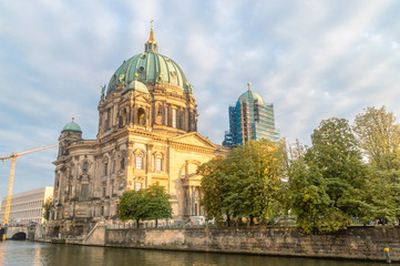 Fototapeta na wymiar Berlin Cathedral (Berliner Dom) view from Spree River at sunset time.