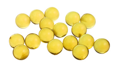 yellow capsules with oil isolated on white