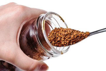 glass jar with instant coffee and spoon isolated