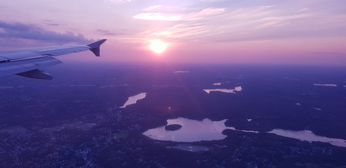 Naklejka premium Aerial view of the city of Boston during the sunset from the window of a plane. Wing