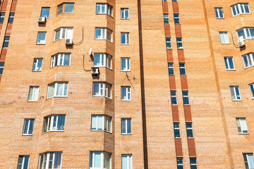 Fototapeta premium facade of urban brick multi-storey house