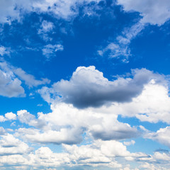 Obraz na płótnie Canvas cumulus gray rain and white clouds in blue sky
