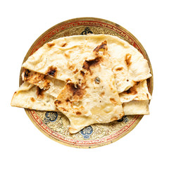 Naan flat bread on brass plate isolated