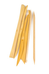 red clay and wooden modeling tools