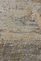Texture of an old wall. Surface of an ancient temple in Prague. Background of stone for the designer. Pattern in brown tones