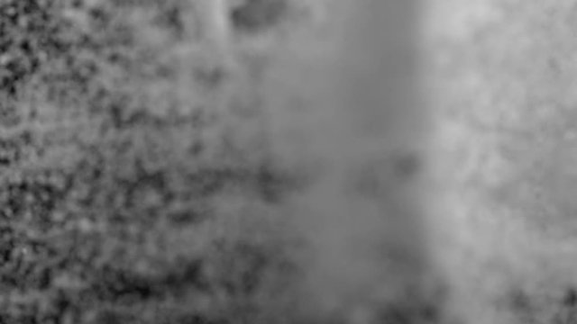 Camera follows throwing kosher salt into water. Overhead shot. Shot with high speed camera, phantom flex 4K. Slow Motion.