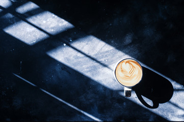 coffee on concrete background light leak