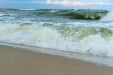 Sea coast. Waves and storms at sea. Waves on the Baltic Sea.