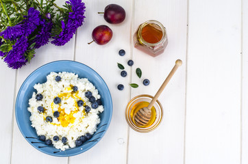 Dairy products in dietary foods. Cottage cheese with fresh berries and honey