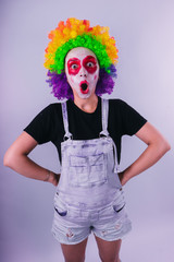 girl in a bright image of a clown. emotional portrait of a student. costumed presentation of...