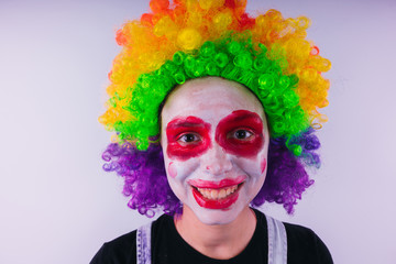 girl in a bright image of a clown. emotional portrait of a student. costumed presentation of...