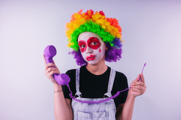 girl in a bright image of a clown. emotional portrait of a student. costumed presentation of...